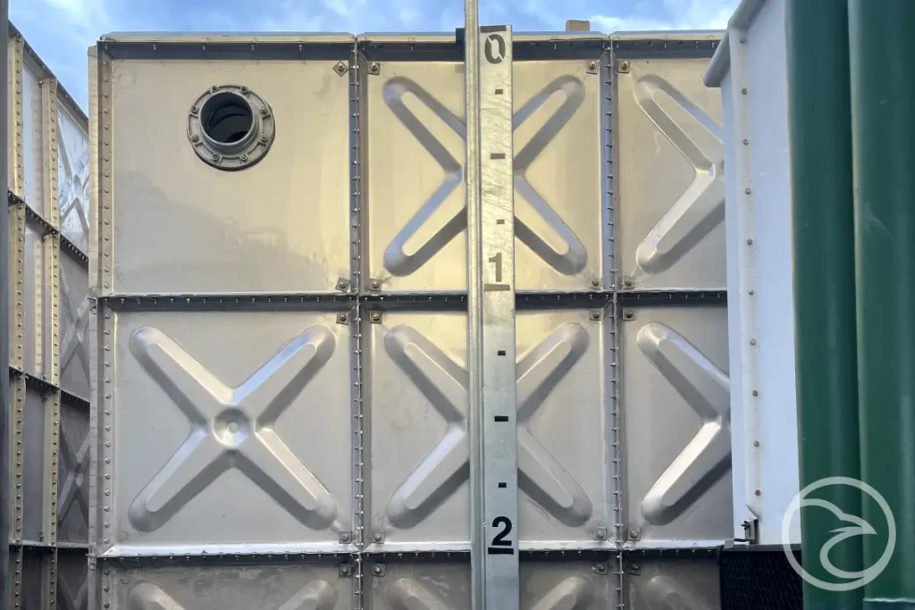 Industrial water storage tanks installed at manufacturing facility