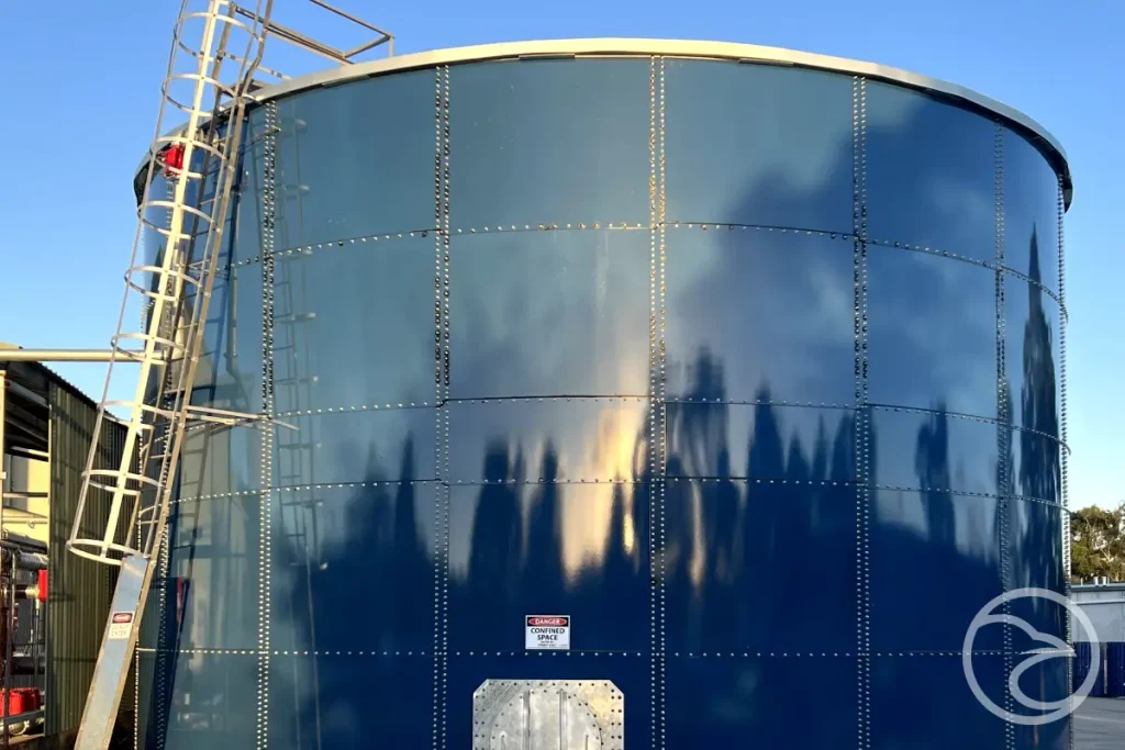 Modular steel panels being prepared for high-temperature glass fusion