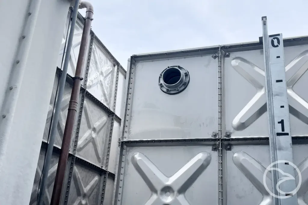 Stainless steel water tank installation at commercial site