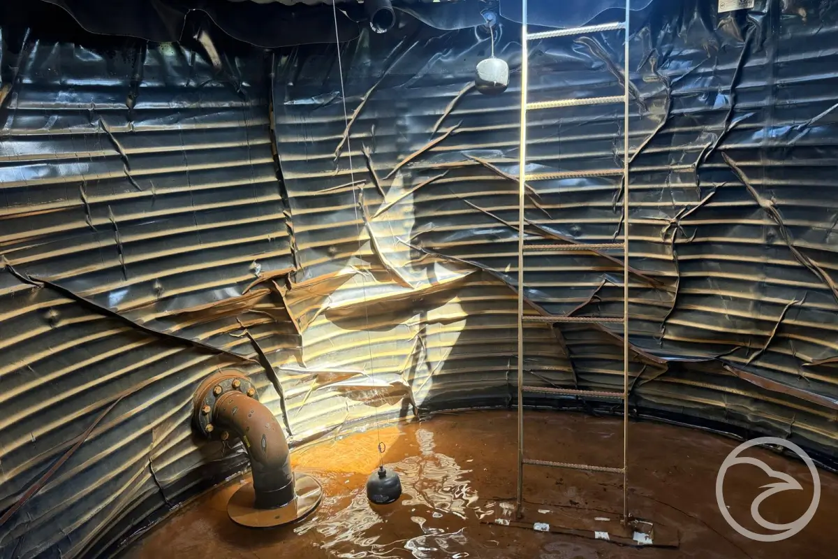 large water tank where sediment can accumulate over time