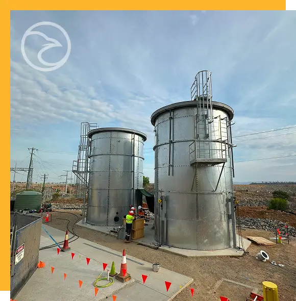 Technician performing routine fire water tank maintenance at an industrial facility
